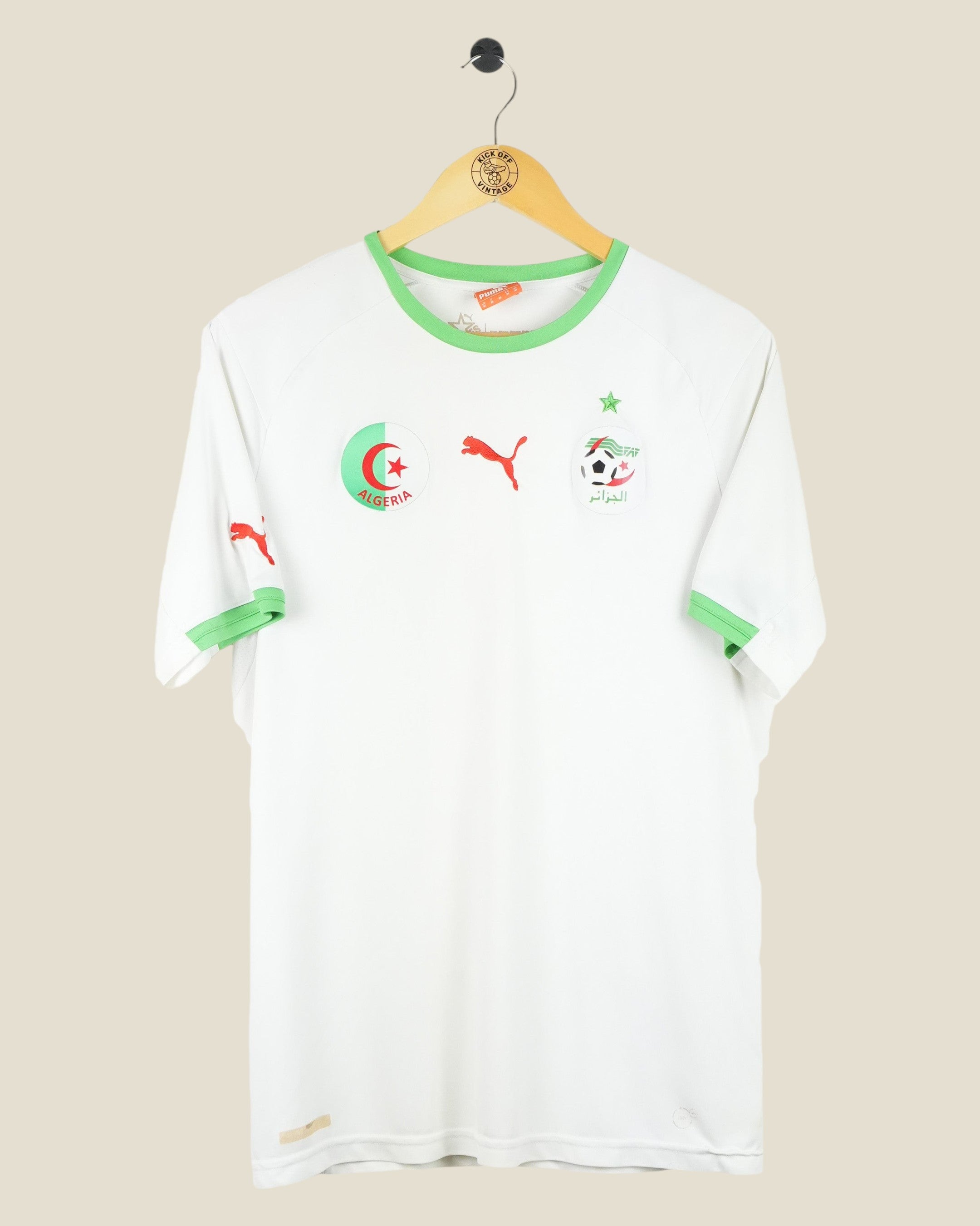 Kick Off Vintage Algeria 2014 home football shirt in white with green trim, Puma logo, and team crest on a hanger.