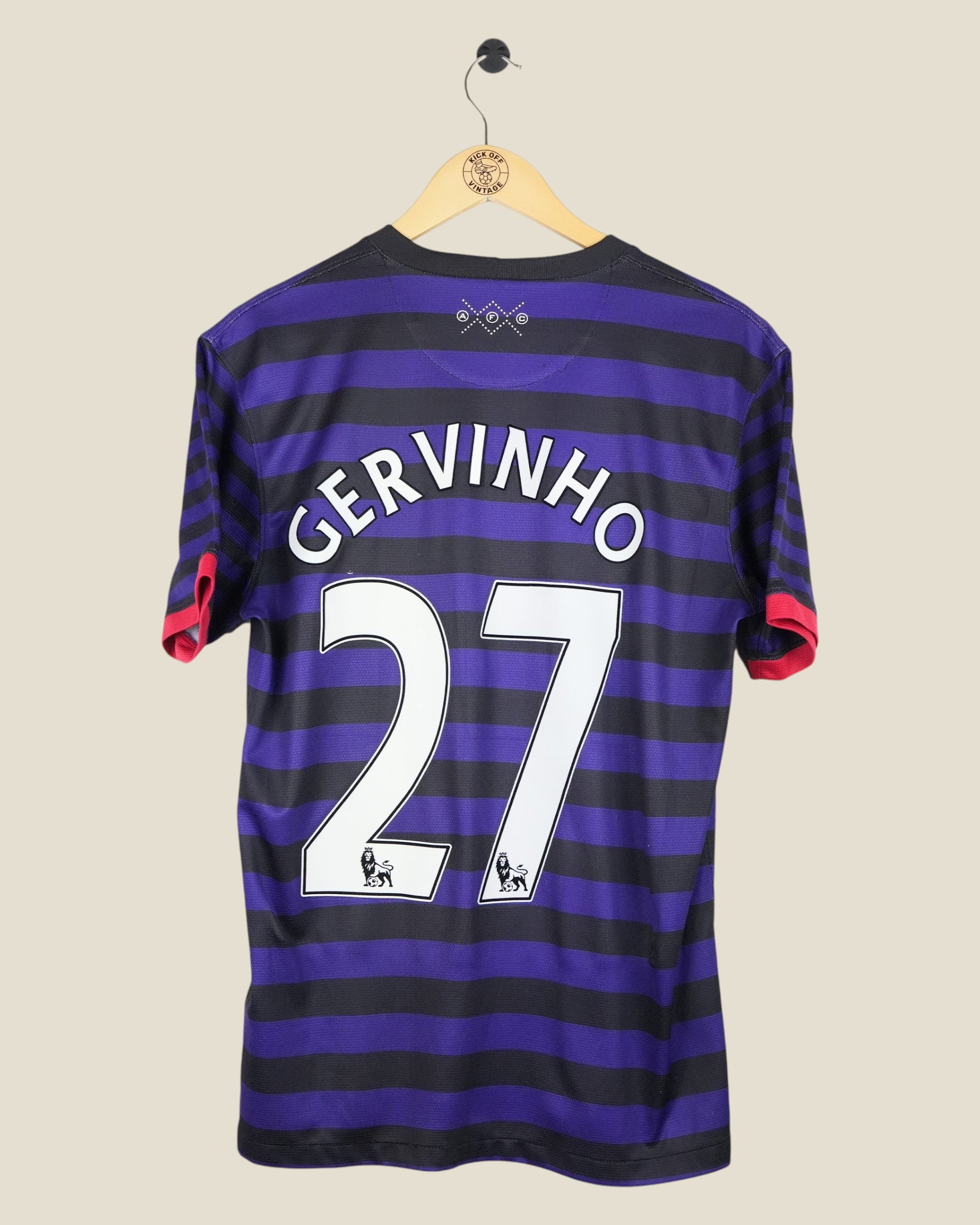 Kick Off Vintage Arsenal 2012/13 away shirt featuring Gervinho number 27 in purple and black stripes