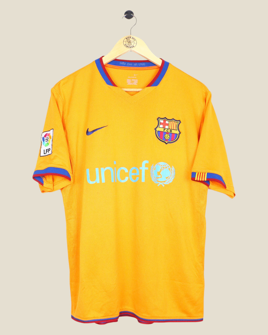 Kick Off Vintage 2006/07 FC Barcelona away jersey in orange with blue and red trim, featuring Nike and Unicef logos.