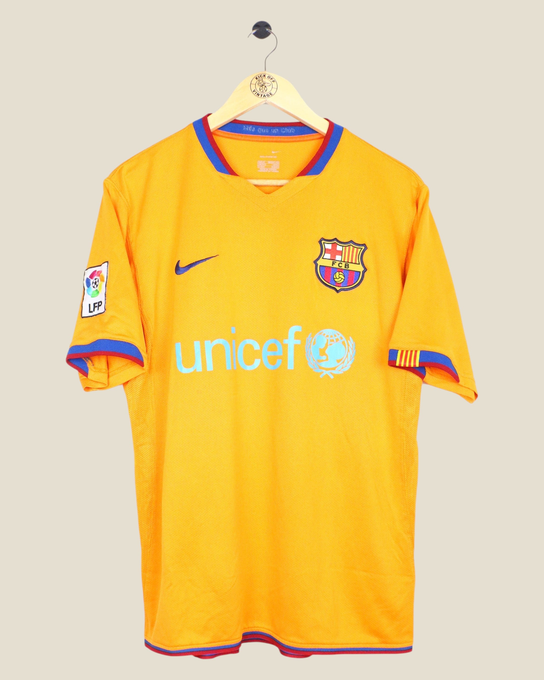 Kick Off Vintage 2006/07 FC Barcelona away jersey in orange with blue and red trim, featuring Nike and Unicef logos.