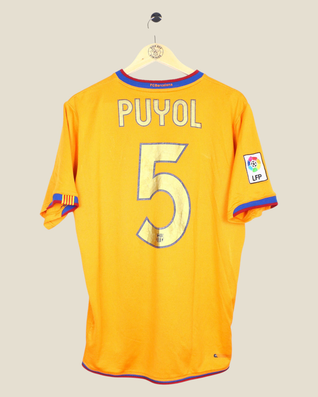 Kick Off Vintage Barcelona 2006/07 away jersey featuring Puyol number 5 on the back in yellow with blue and red trim.