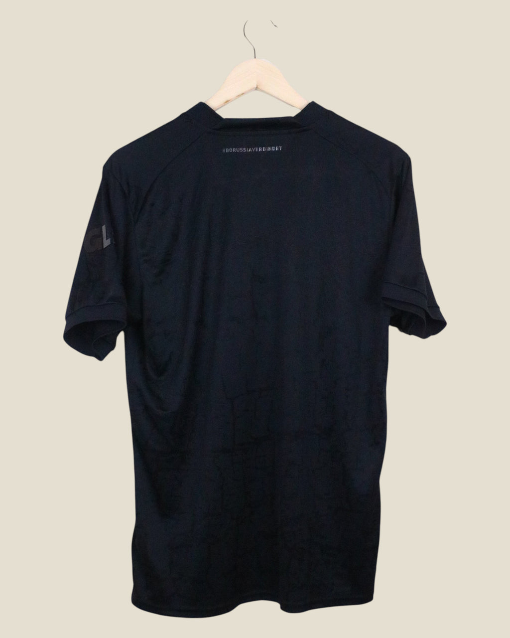 Kick Off Vintage Borussia Dortmund 2022/23 blackout football shirt, back view with subtle branding details.