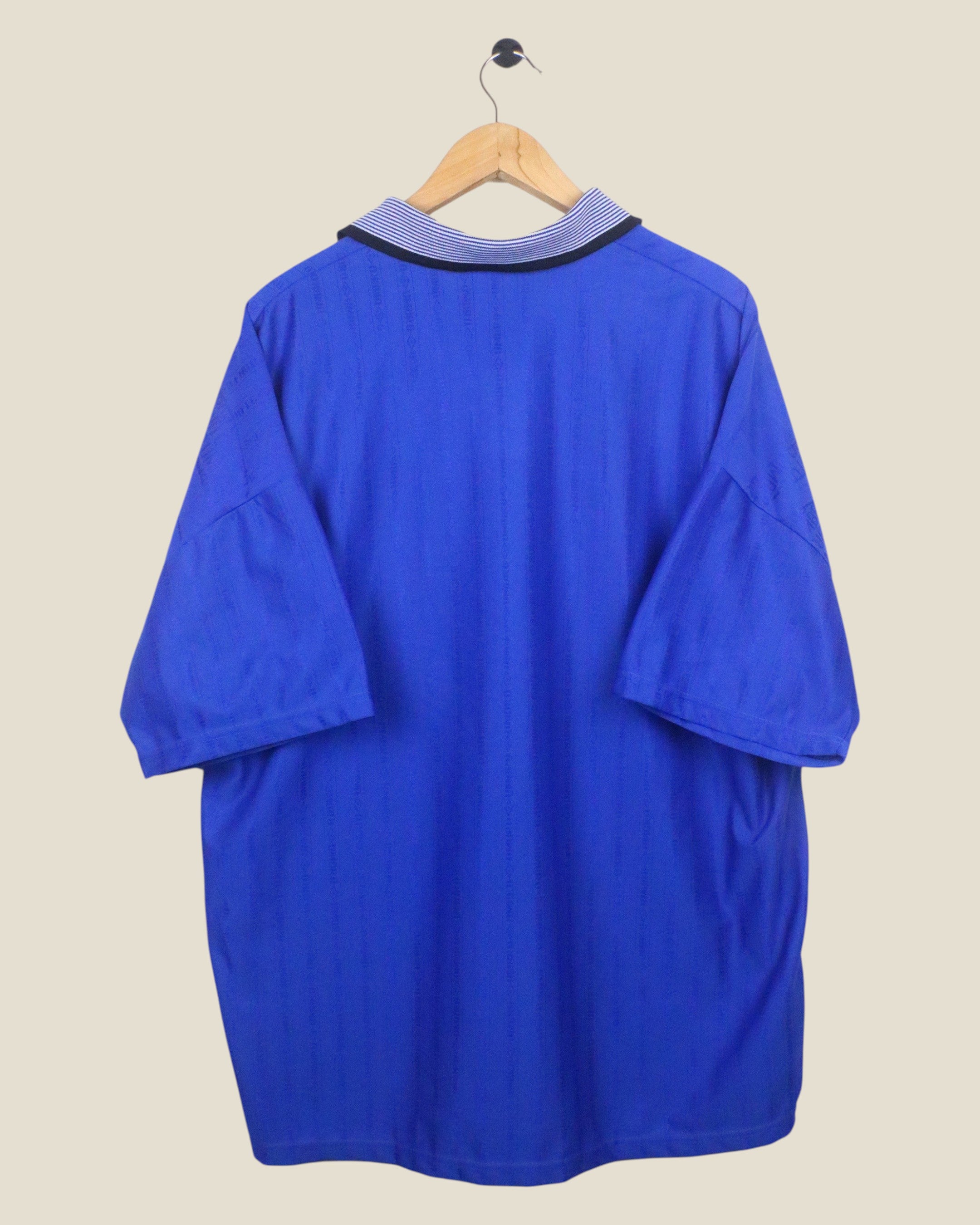 Back view of a vintage Kick Off Vintage Everton 1995/96 Umbro home football shirt in blue with a striped collar.