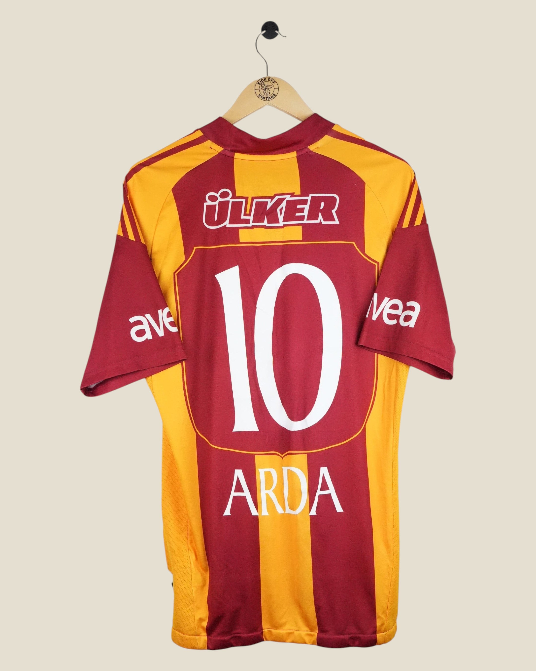 Kick Off Vintage Galatasaray 2010/11 Arda Turan home shirt with number 10 in red and yellow striped design