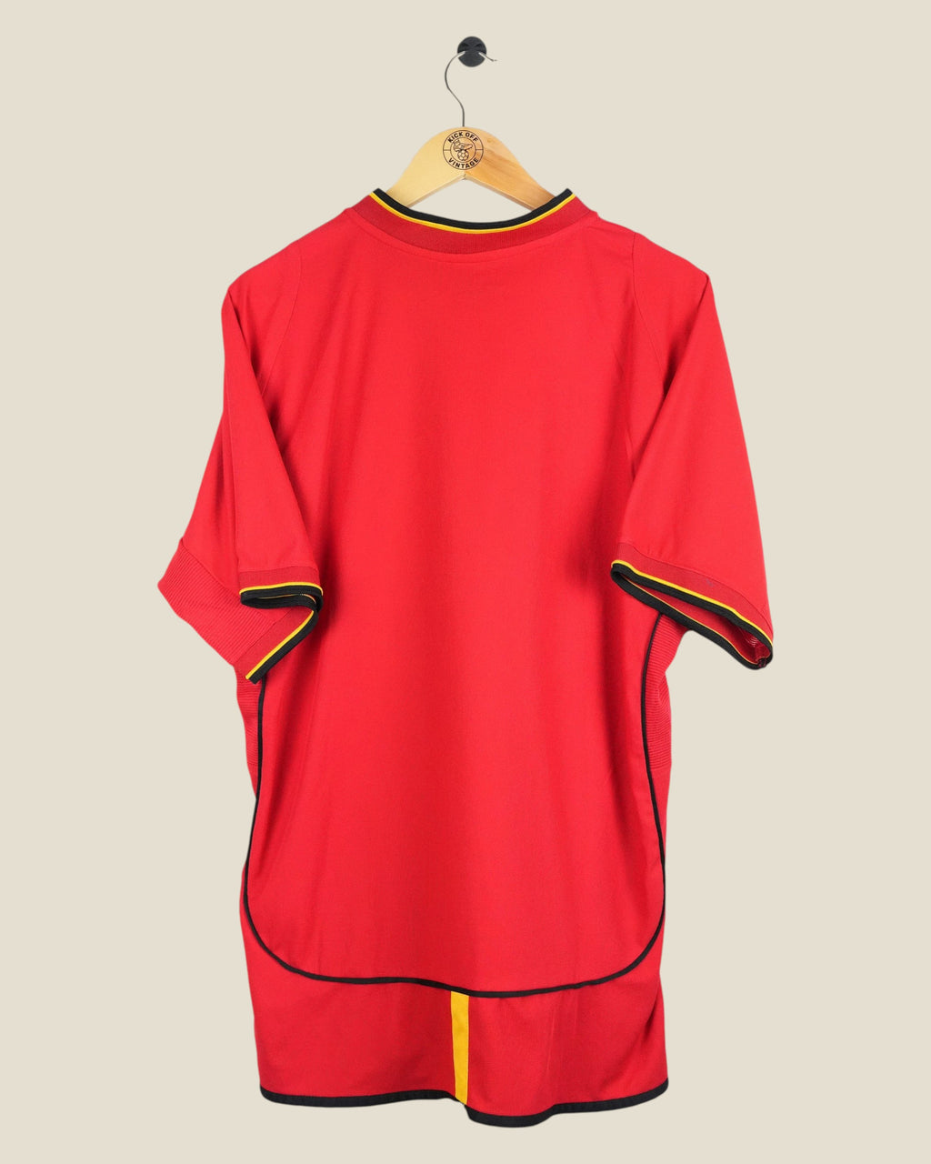 Kick Off Vintage Galatasaray 2002/03 away football shirt in red with yellow and black trim on a wooden hanger