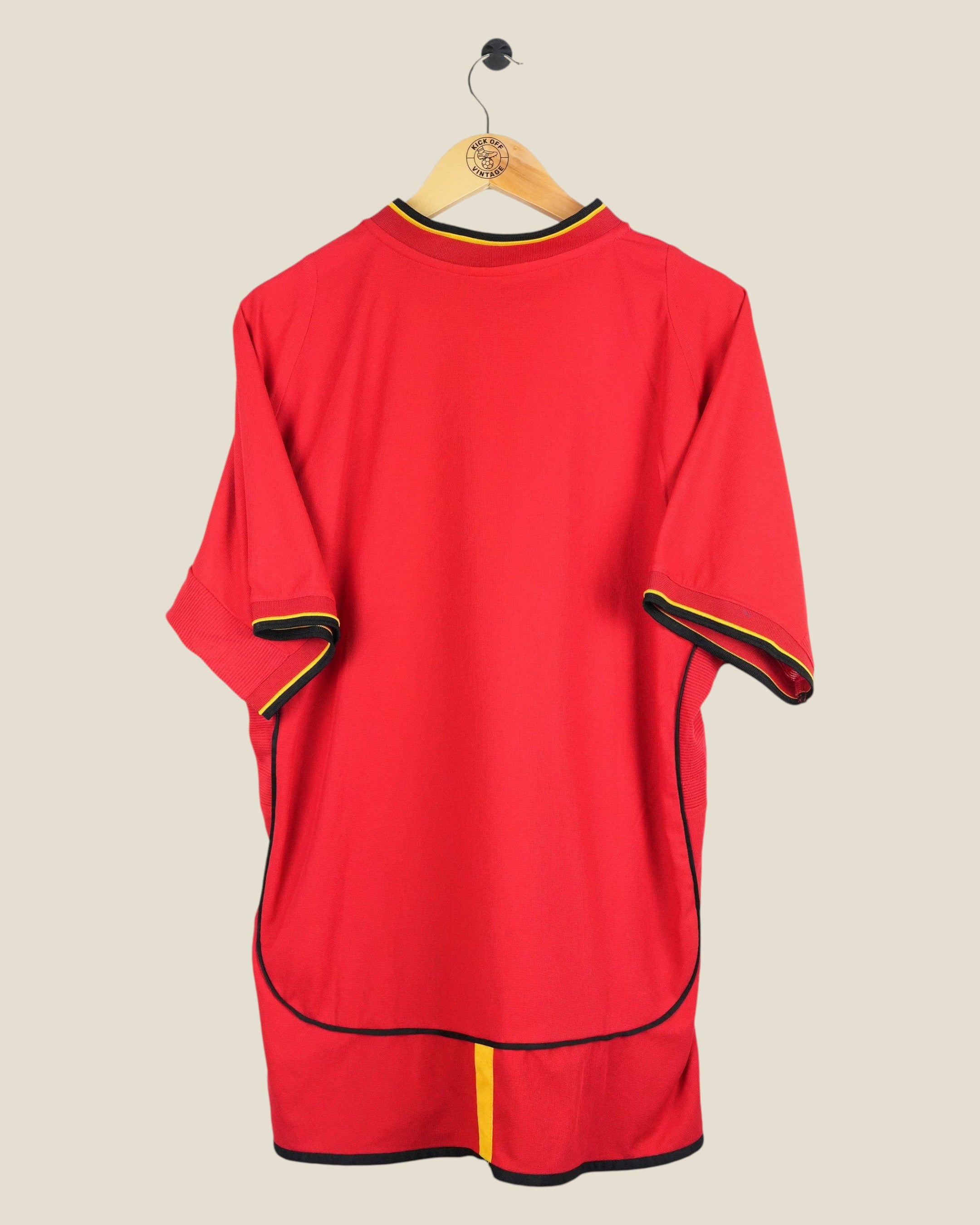 Kick Off Vintage Galatasaray 2002/03 away football shirt in red with yellow and black trim on a wooden hanger
