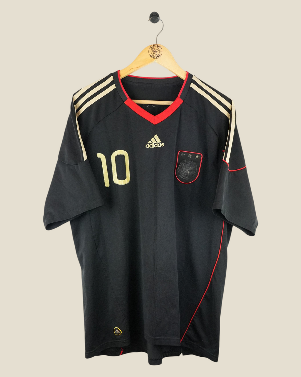 Kick Off Vintage Germany 2010 Podolski away football jersey in black with gold number 10 and red trim details