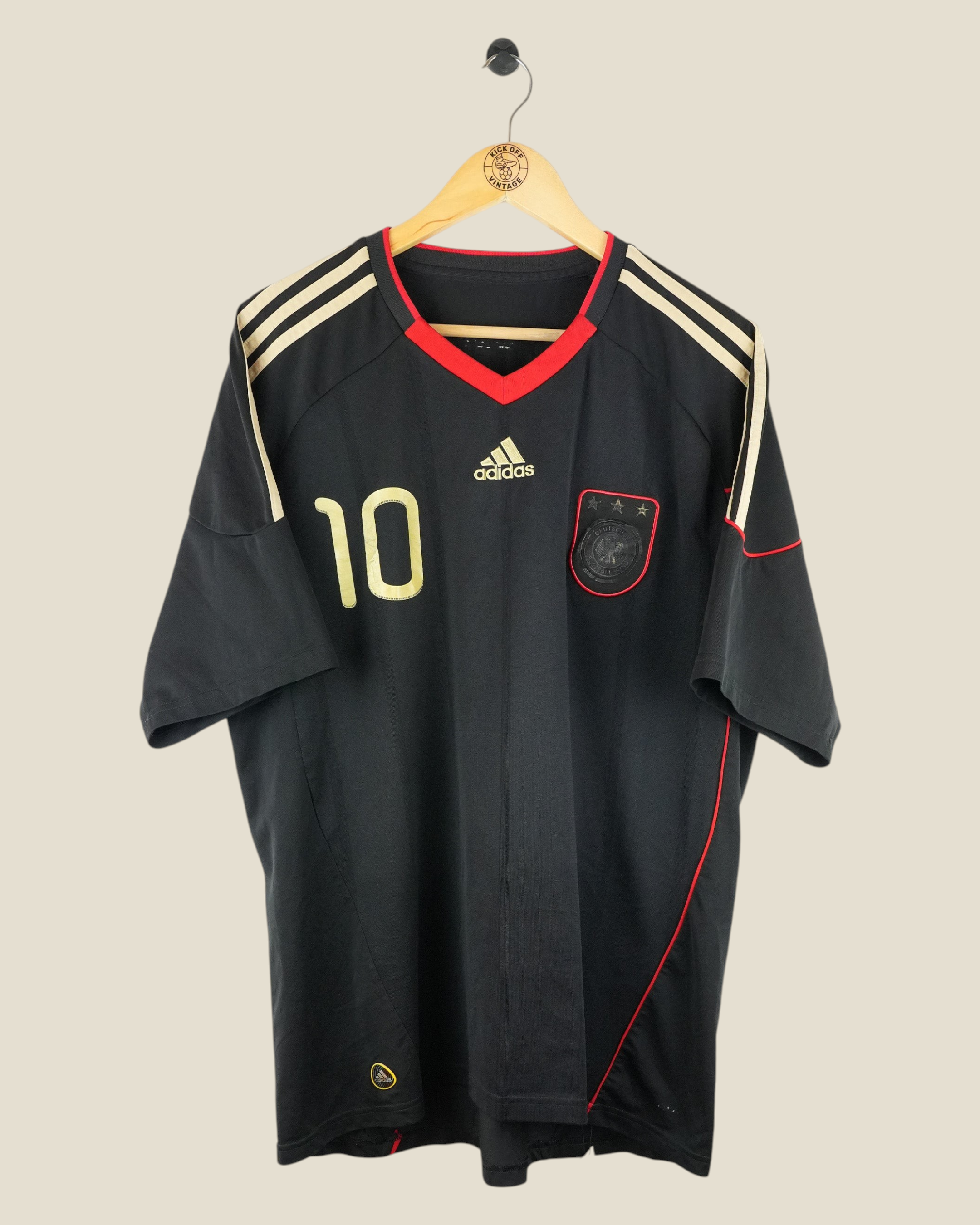 Kick Off Vintage Germany 2010 Podolski away football jersey in black with gold number 10 and red trim details