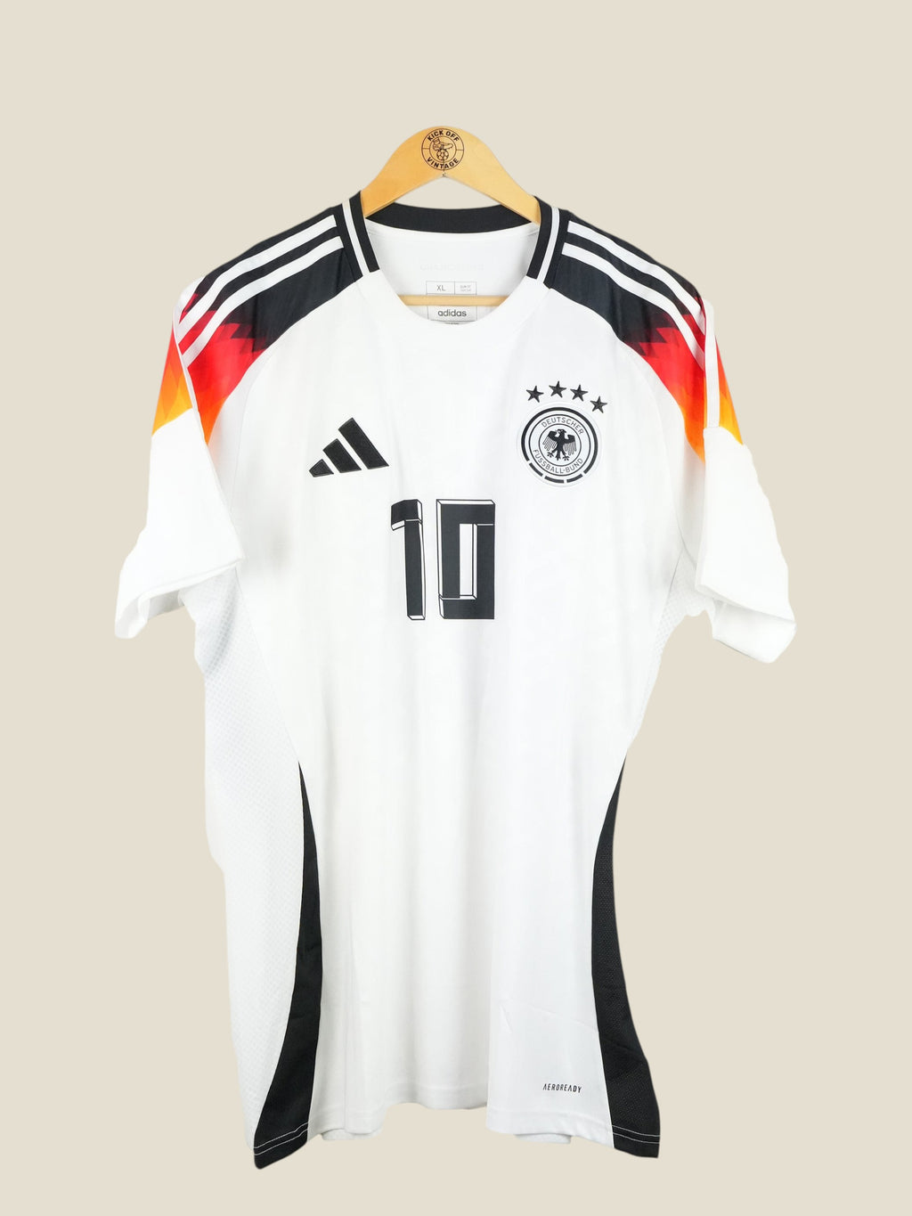Kick Off Vintage Germany 2024 Musiala home football jersey in white with black, red, and gold shoulder details.
