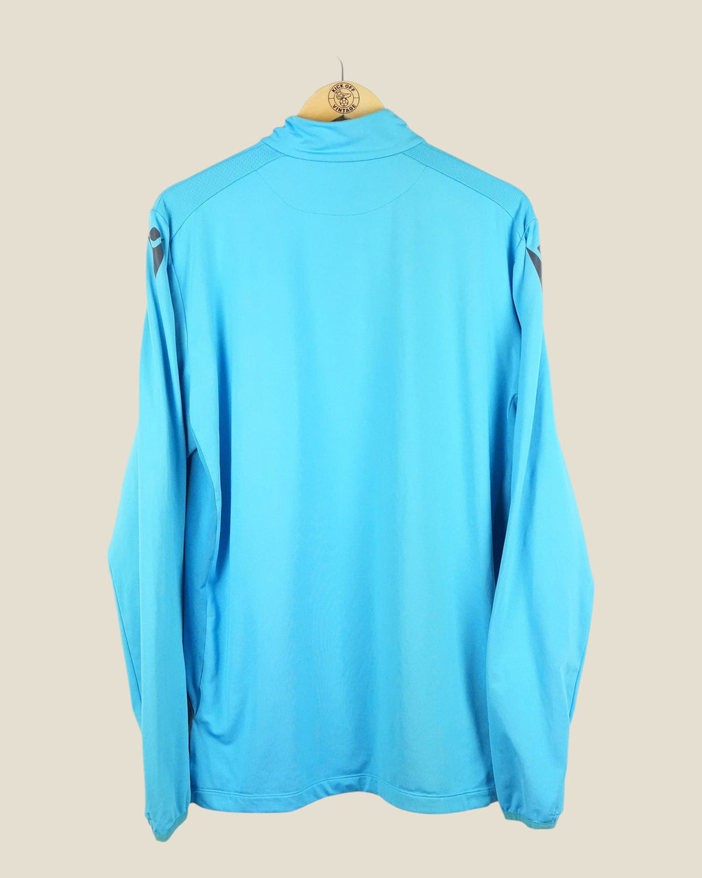 Kick Off Vintage Heerenveen 2024/25 Macron training sweater in light blue, back view on a wooden hanger.