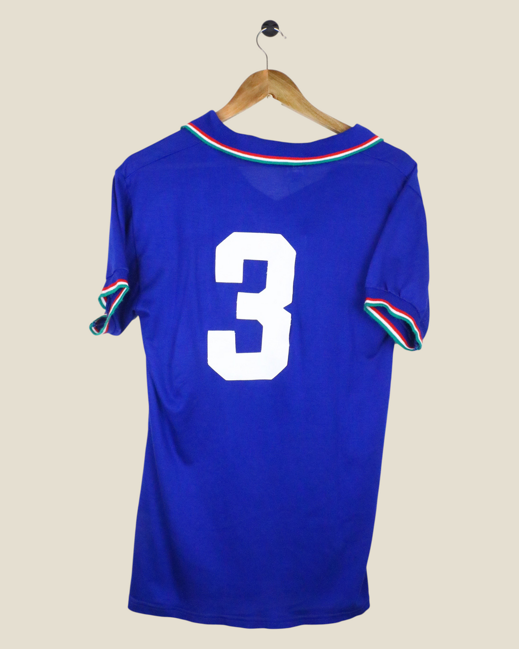 Back view of a vintage 1990 Italy home football jersey by Kick Off Vintage featuring number 3 in white on blue fabric