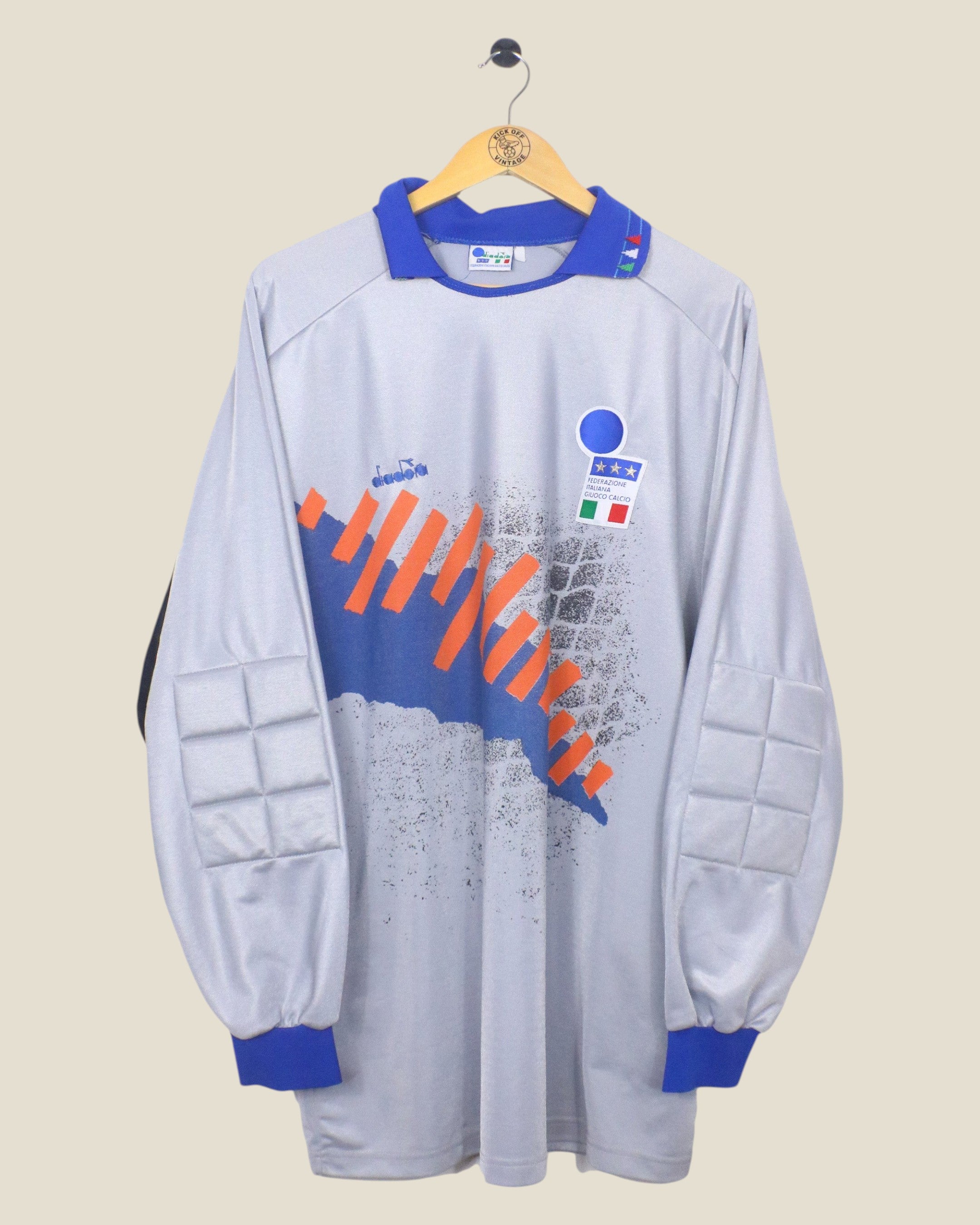 Kick Off Vintage 1992-94 Italy goalkeeper jersey by Diadora in grey with blue collar and orange graphic details.