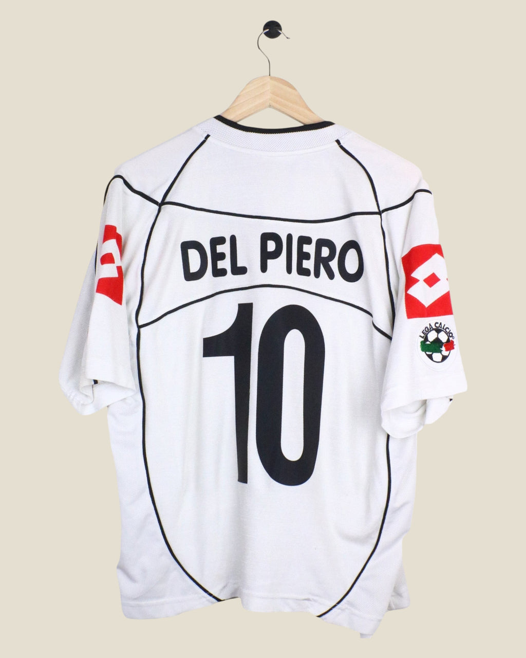 Kick Off Vintage Juventus 1998/99 Del Piero #10 home football jersey in white with black details on a wooden hanger