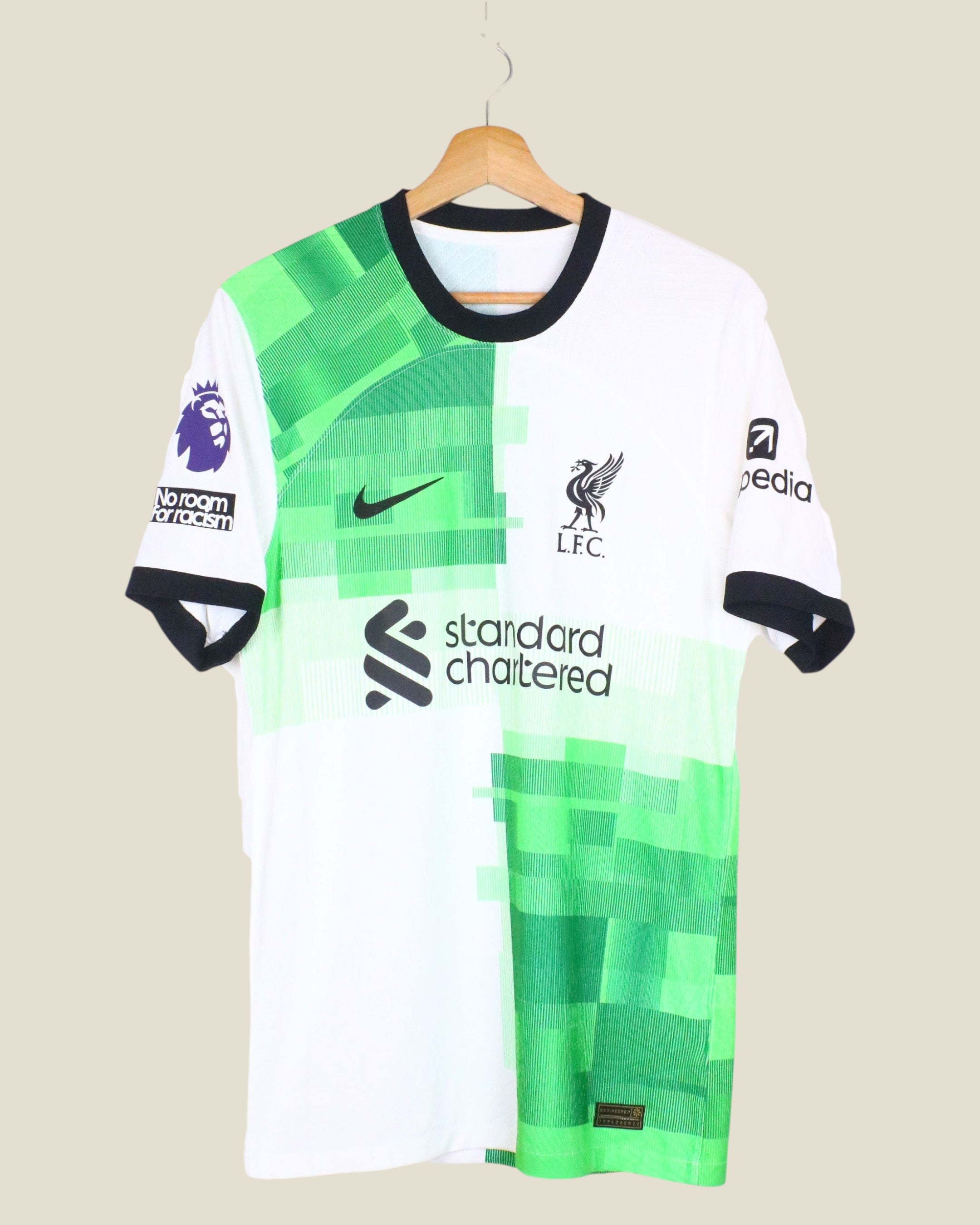 Kick Off Vintage Liverpool 2023/24 Salah away player version jersey in white and green with black trim on a hanger