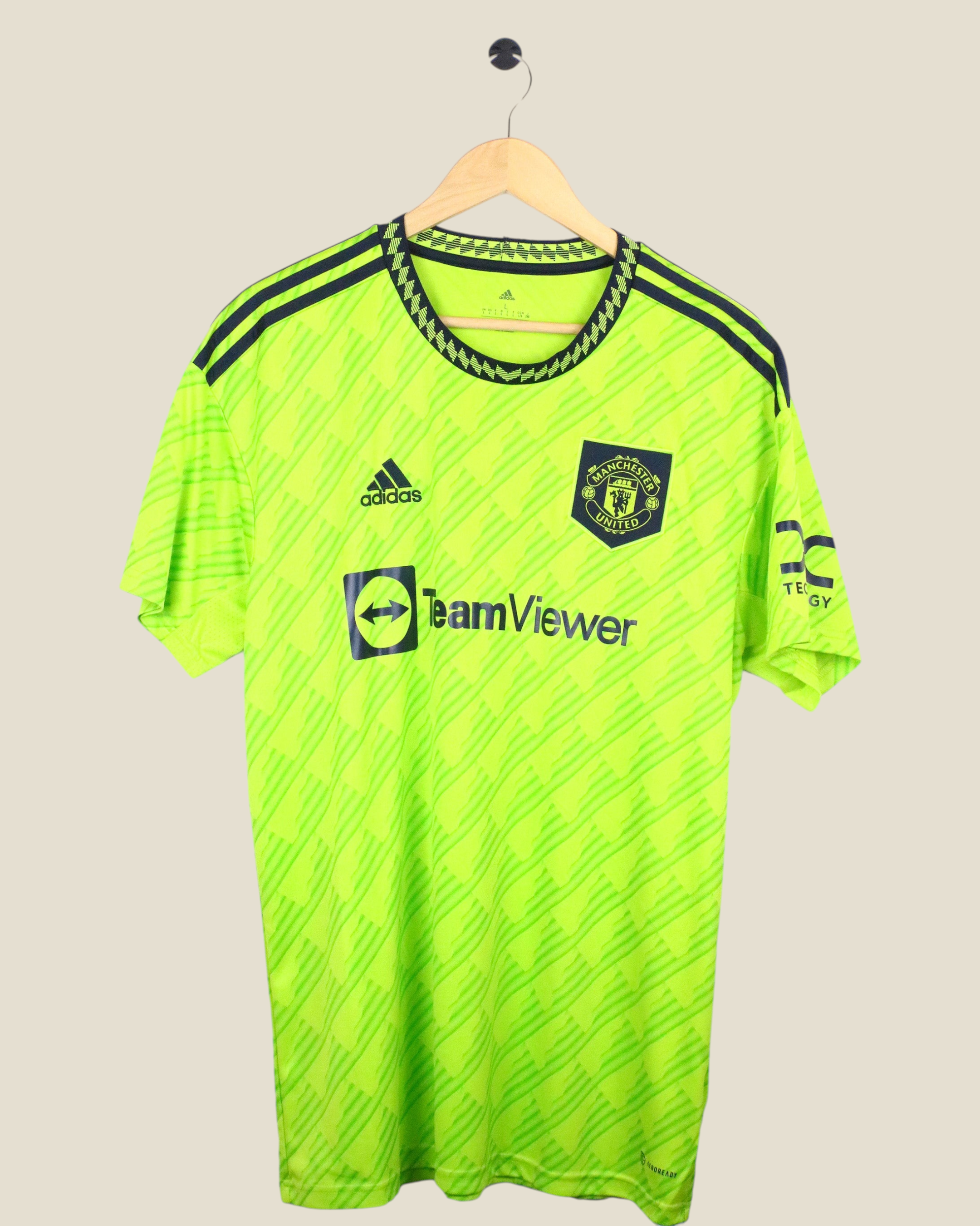 Kick Off Vintage Manchester United 2022/23 Antony away jersey in neon green with black Adidas branding and details.