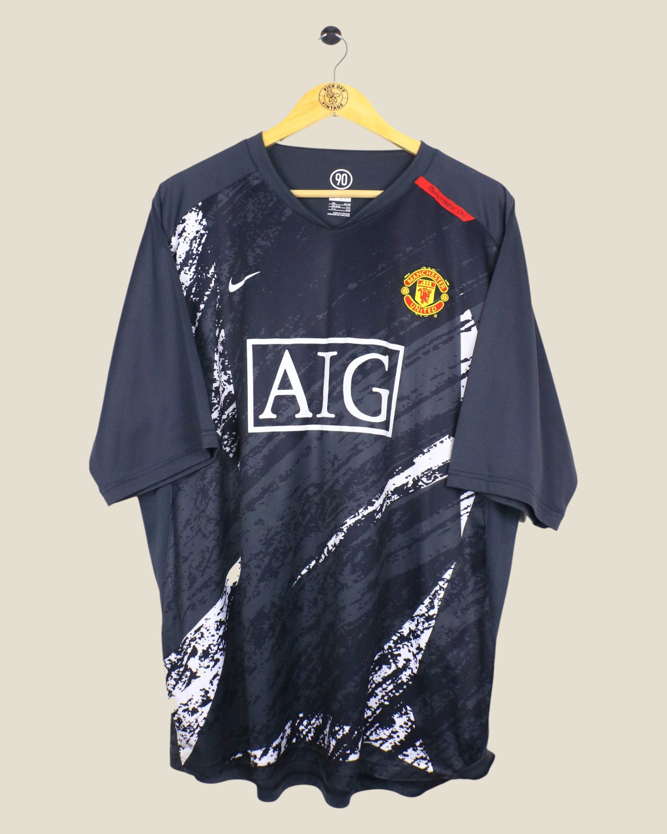 Kick Off Vintage Manchester United 2007/08 Nike training shirt in black with white graphic print and AIG sponsor logo
