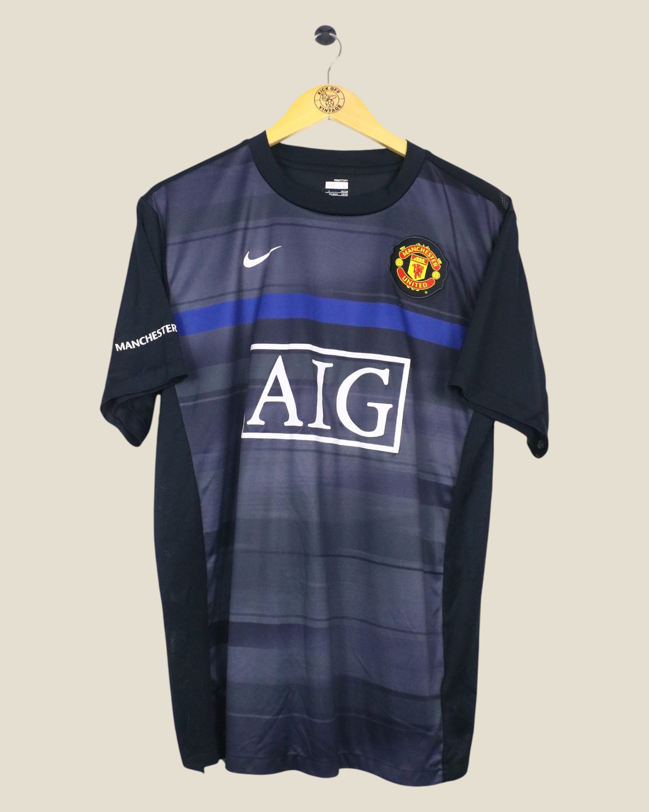 Kick Off Vintage Manchester United 2009/10 Nike training shirt in black and blue with AIG sponsor logo
