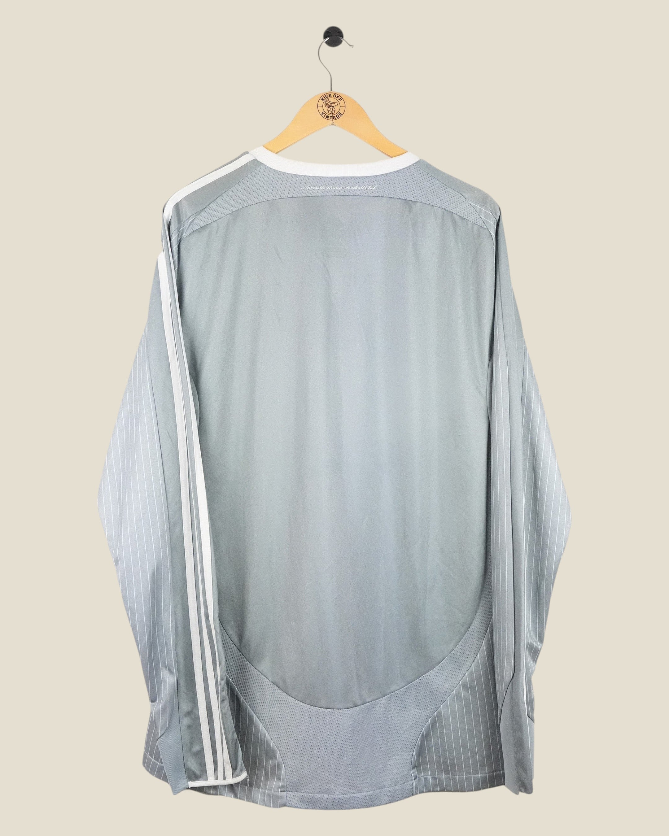 Back view of a grey Kick Off Vintage Newcastle United 2008/09 long sleeve third football shirt by Adidas