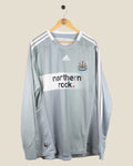 Kick Off Vintage Newcastle United 2008/09 long sleeve third football shirt in grey with white pinstripes and logo.