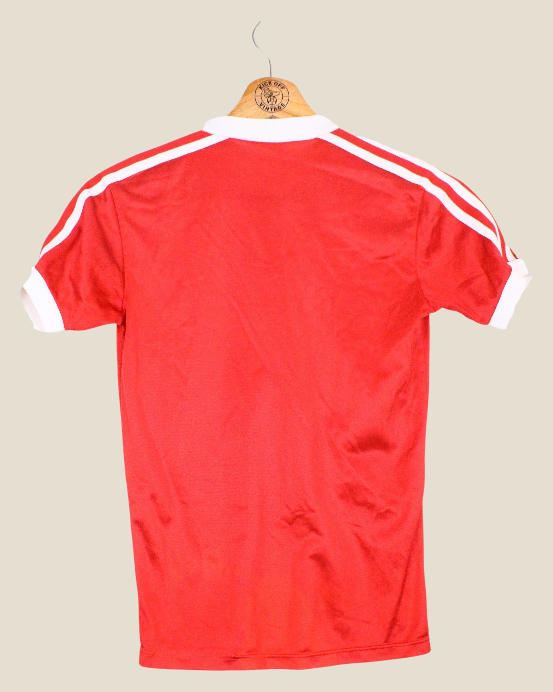 Kick Off Vintage Nottingham Forest 1980/81 home football shirt in red with white Adidas stripes, back view.