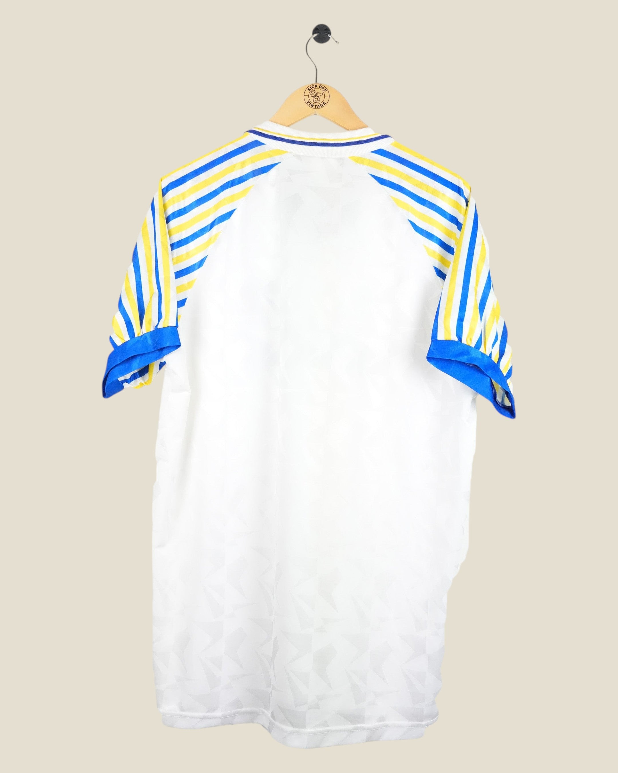 Back view of Kick Off Vintage Parma 1990-92 home football shirt featuring white body and yellow-blue striped sleeves.