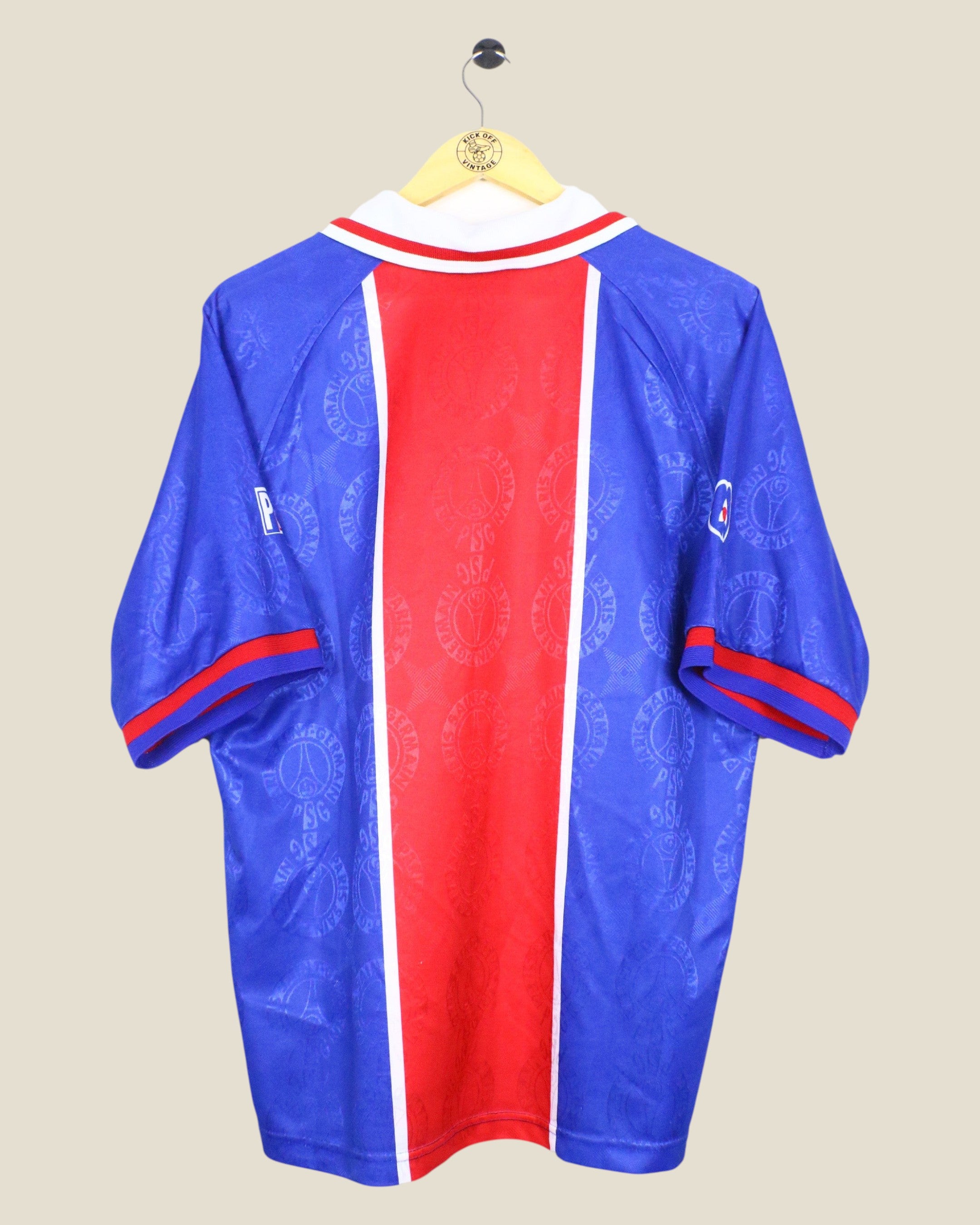Back view of a vintage Kick Off Vintage Paris Saint-Germain 1996/97 home football shirt in blue and red.