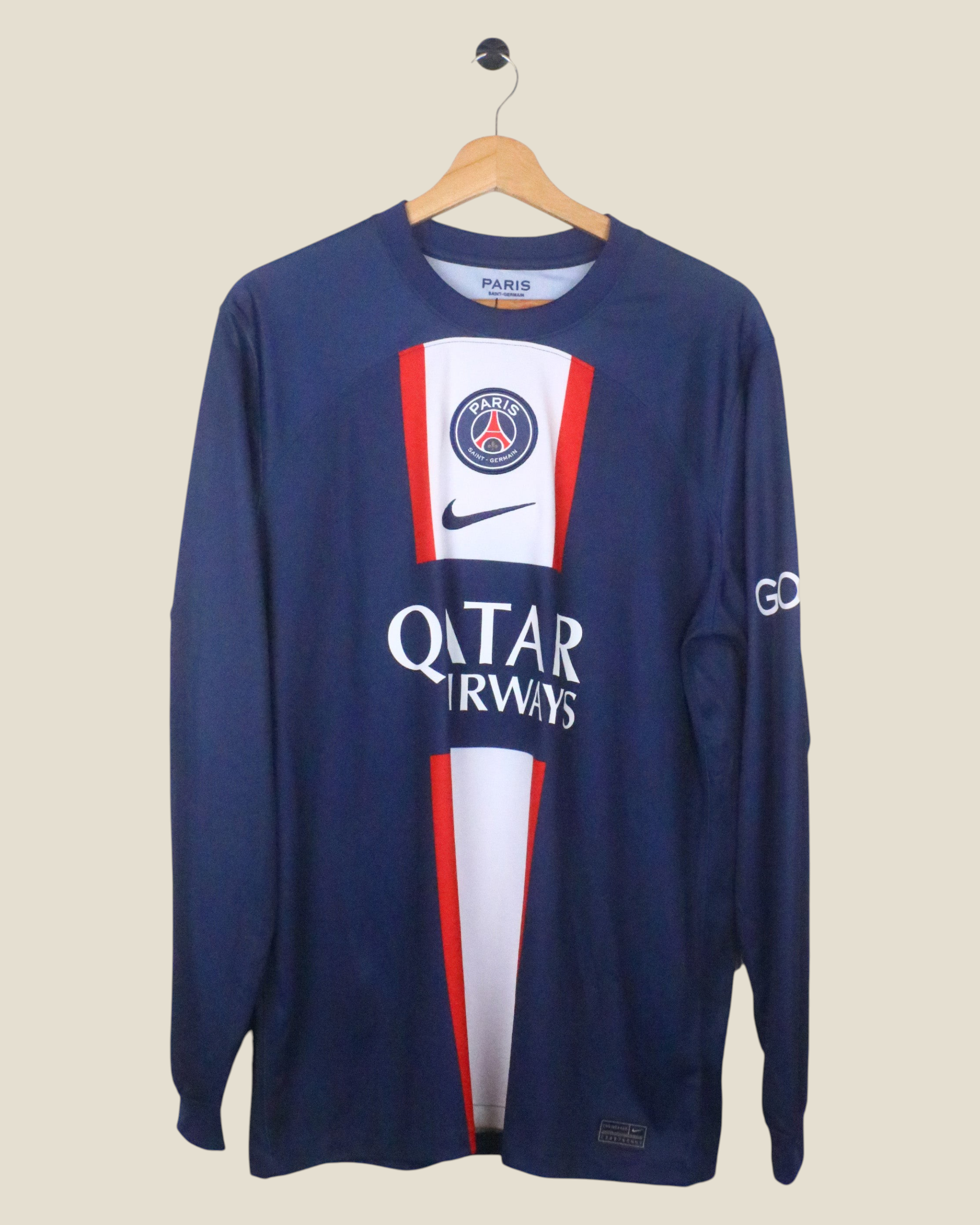 Kick Off Vintage Paris Saint-Germain 2022/23 Messi #30 long sleeve home jersey in navy blue with red and white details.