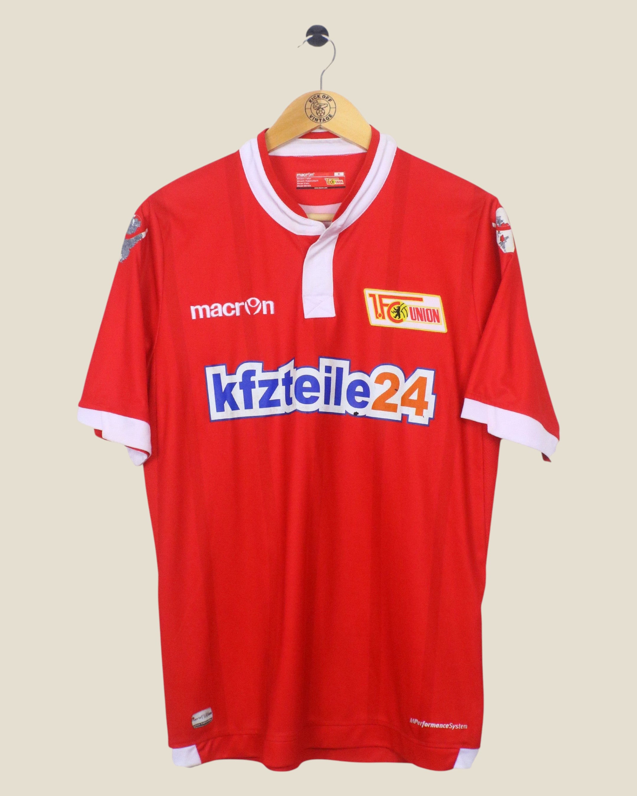 Kick Off Vintage 2015/16 Union Berlin home football jersey by Macron in red with white collar and sponsor logo