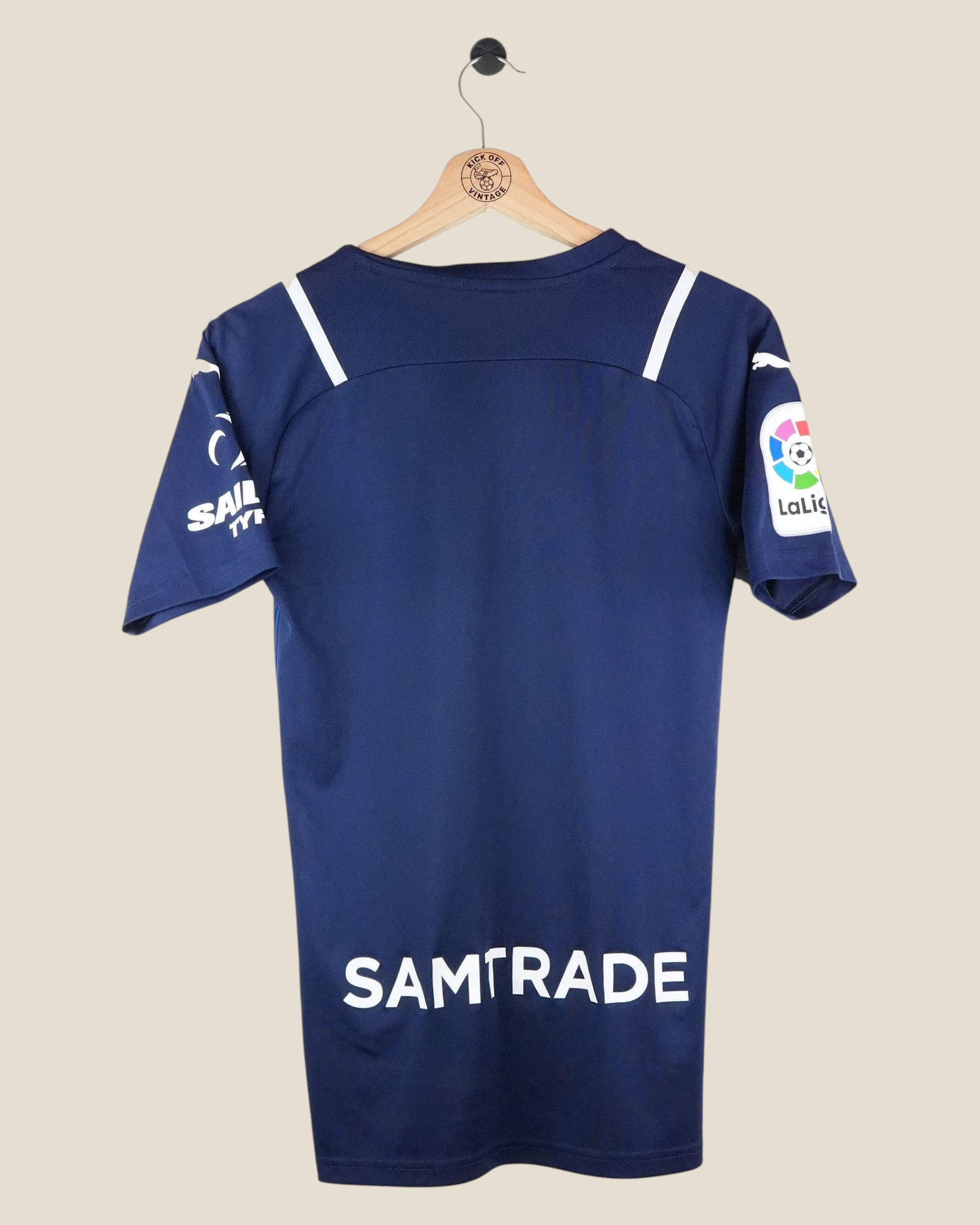 Back view of a navy blue Kick Off Vintage Valencia 2021/22 Puma goalkeeper shirt with white sponsor logos.