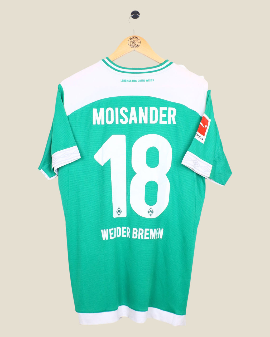 Kick Off Vintage Werder Bremen 2018/19 Moisander home football shirt in green and white with number 18 on the back.